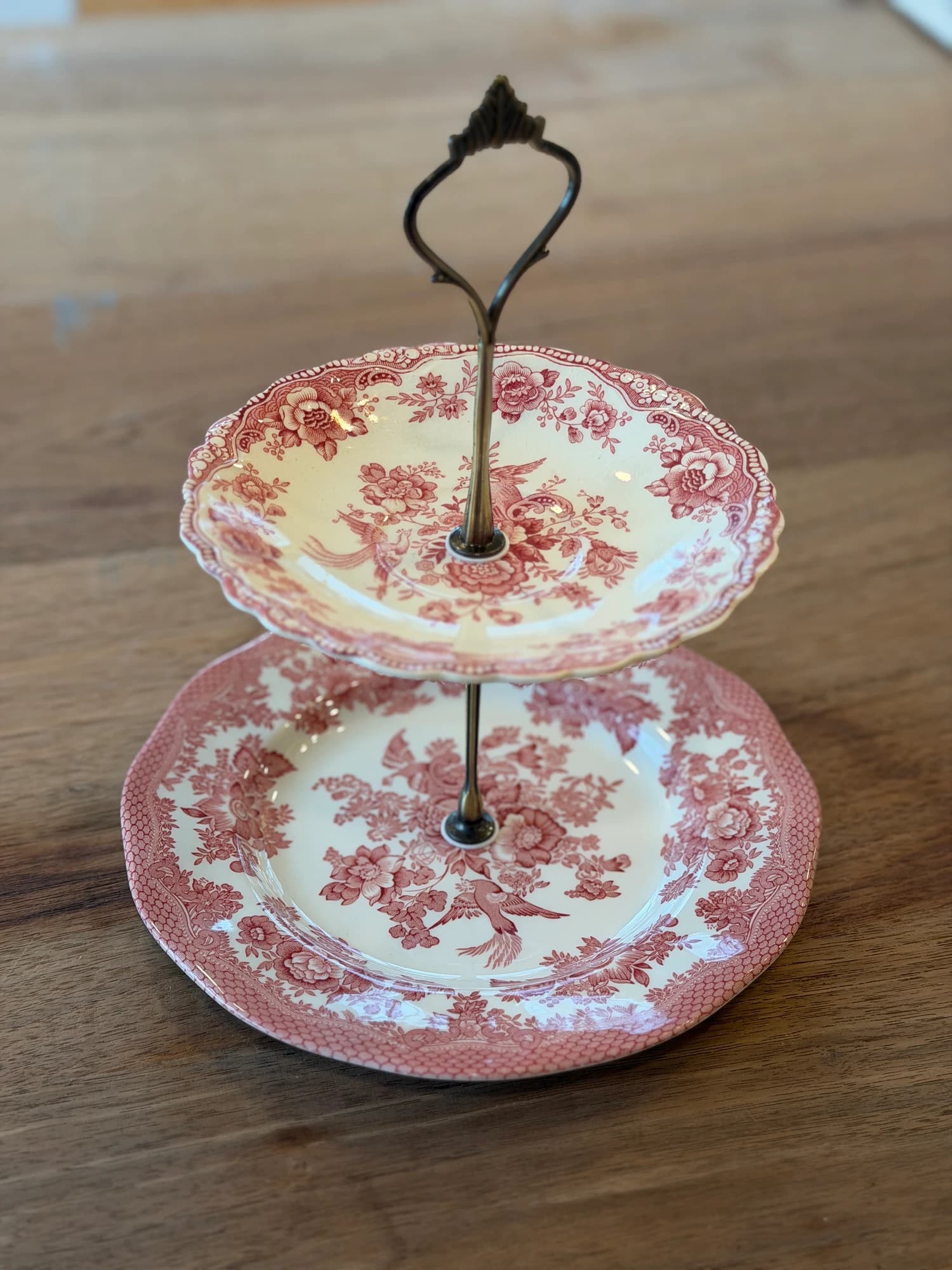 Vintage Bristol plate, adorned with a crimson bird and…