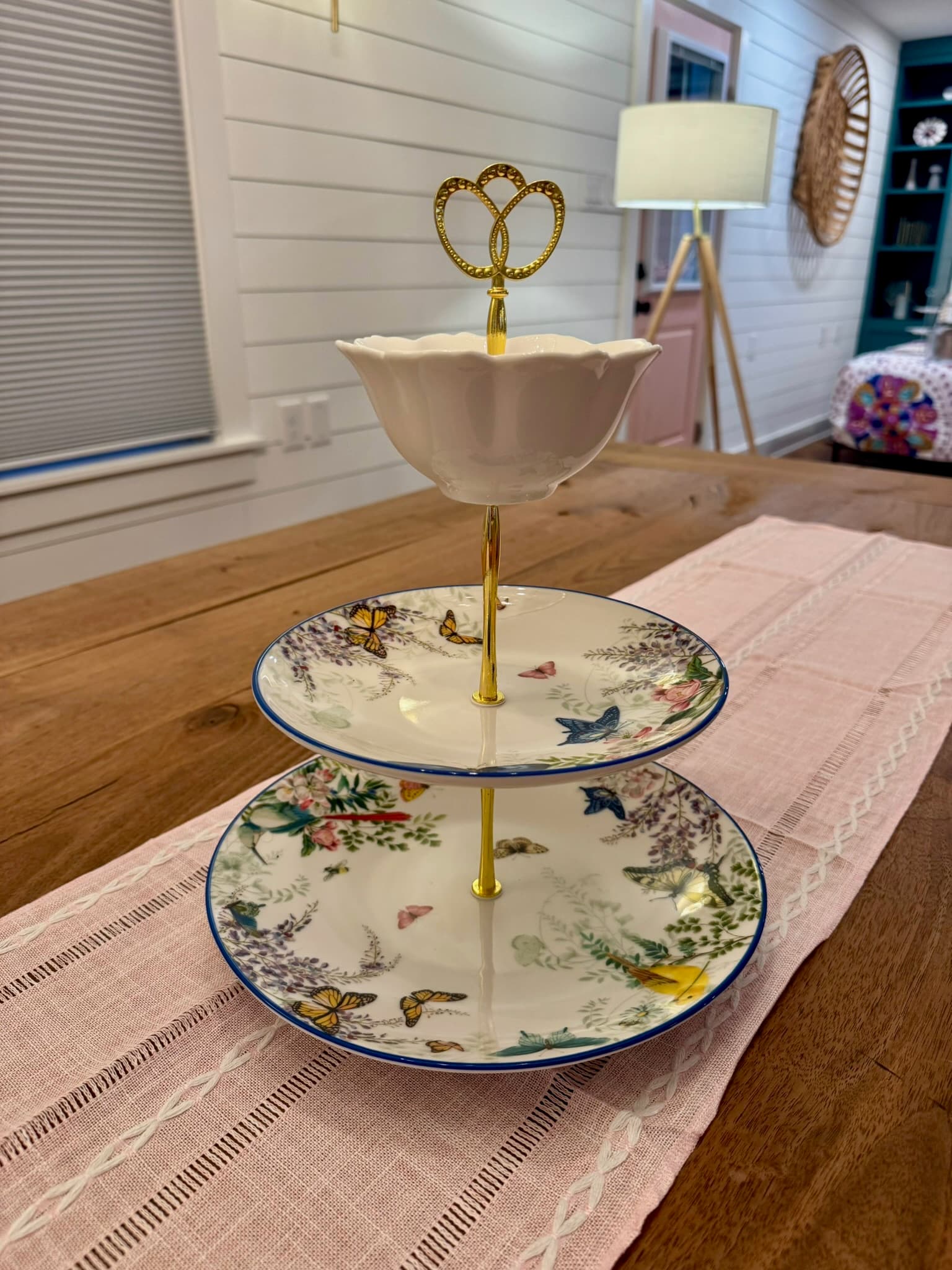 Pottery Barn Meadow china topped with a cream tulip bowl.…